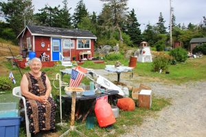 10. Elinor Roberts enjoys greeting guests outside her summer place at the end of the Long Cove Road.cm